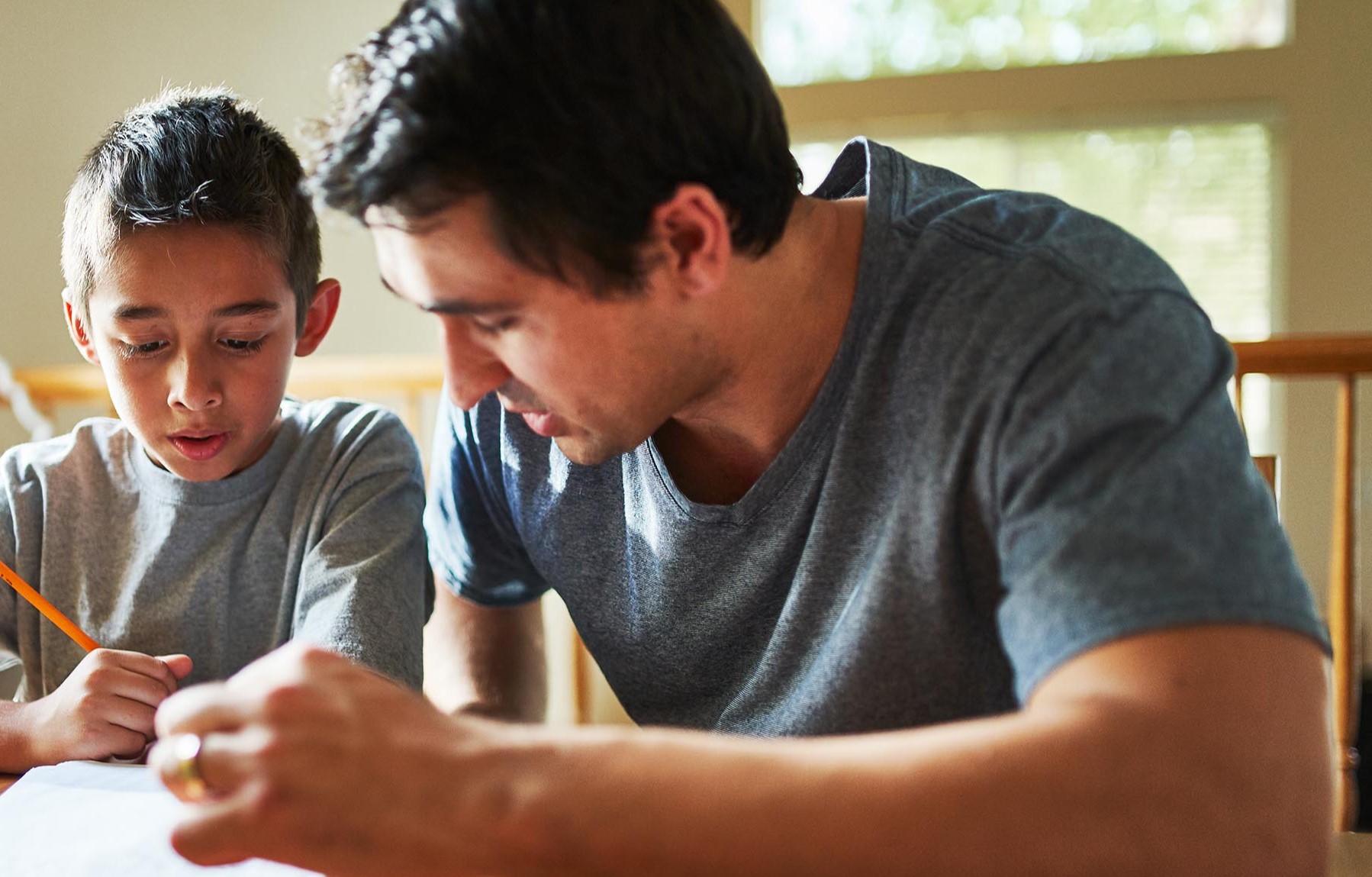 Father helping son with homework