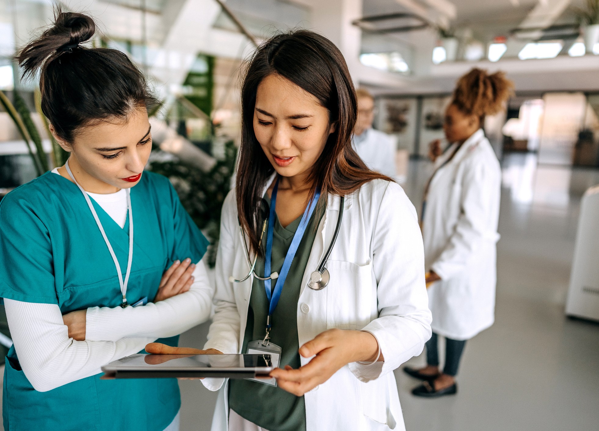 two female healthcare providers discussing